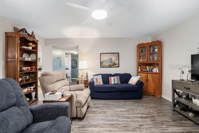 631 Silver Pass, Unit A Ocala, FL 34472 - Photo 14 of 47 a living room with furniture and a wooden floor