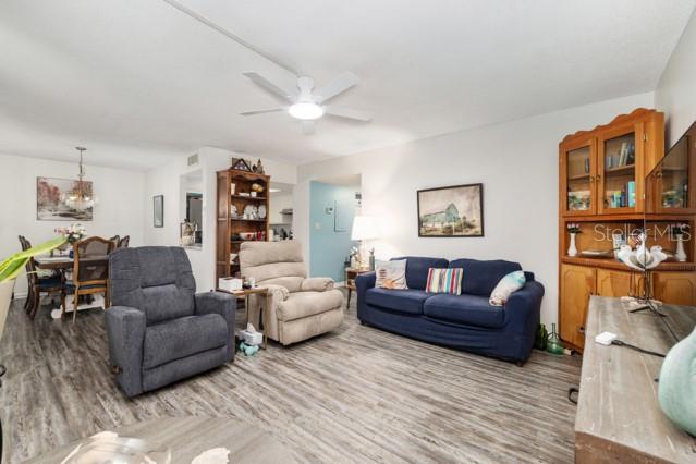 631 Silver Pass, Unit A Ocala, FL 34472 - Photo 15 of 47 a living room with furniture and wooden floor