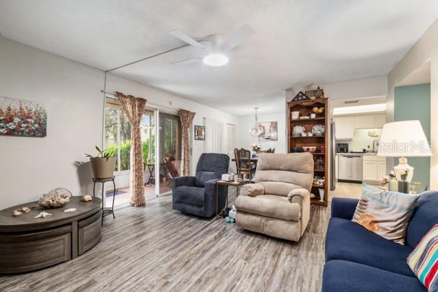 631 Silver Pass, Unit A Ocala, FL 34472 - Photo 16 of 47 a living room with furniture and a wooden floor