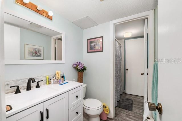 631 Silver Pass, Unit A Ocala, FL 34472 - Photo 30 of 47 a bathroom with a sink toilet and a mirror