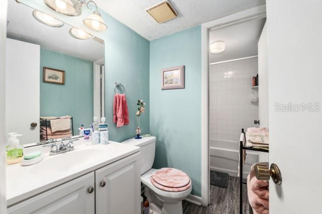 631 Silver Pass, Unit A Ocala, FL 34472 - Photo 32 of 47 a bathroom with a sink vanity mirror and toilet