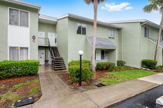 631 Silver Pass, Unit A Ocala, FL 34472 - Photo 4 of 47 a front view of a house with garden
