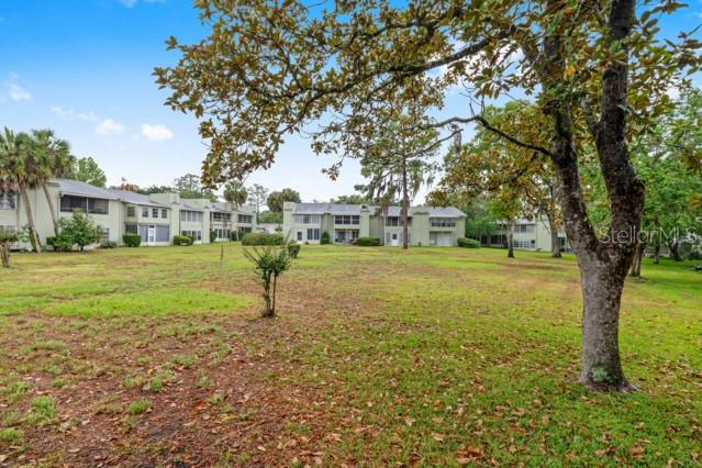 631 Silver Pass, Unit A Ocala, FL 34472 - Photo 45 of 47 a view of outdoor space with garden