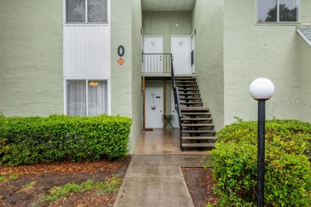 631 Silver Pass, Unit A Ocala, FL 34472 - Photo 5 of 47 a front view of a house with a garden