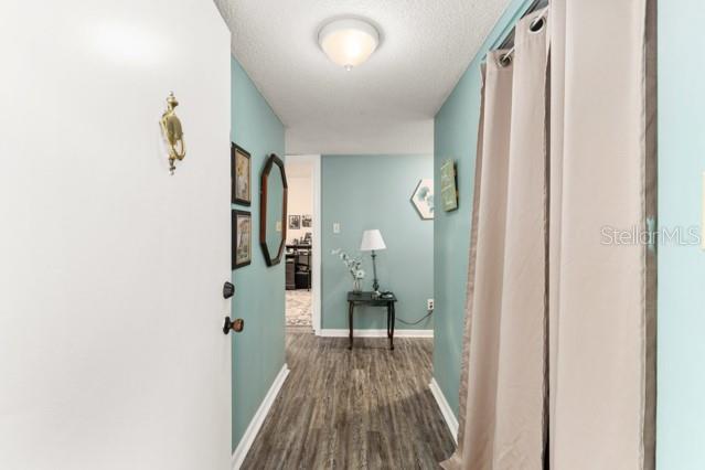 631 Silver Pass, Unit A Ocala, FL 34472 - Photo 9 of 47 a view of a hallway with a hardwood floor and hallway