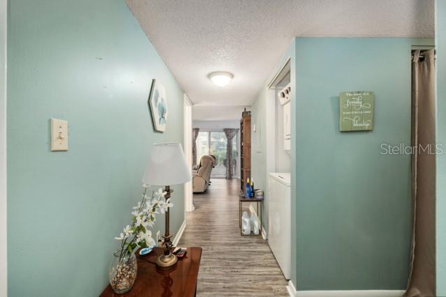 631 Silver Pass, Unit A Ocala, FL 34472 - Photo 10 of 47 a hallway with a potted plant on the wall