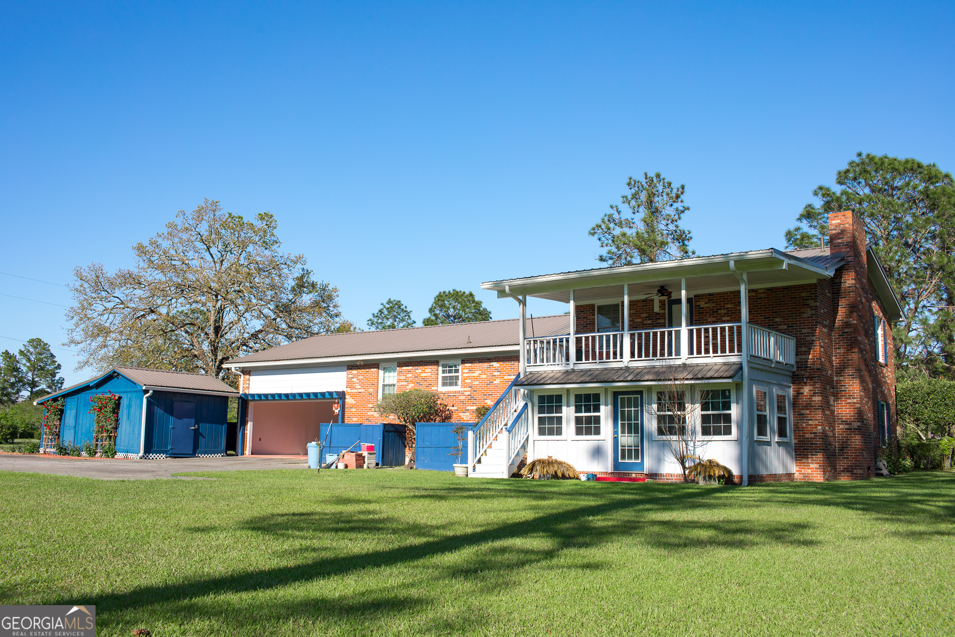 2110 Ware Street Blackshear, GA 31516 - Photo 6 of 57 a front view of a house with a garden