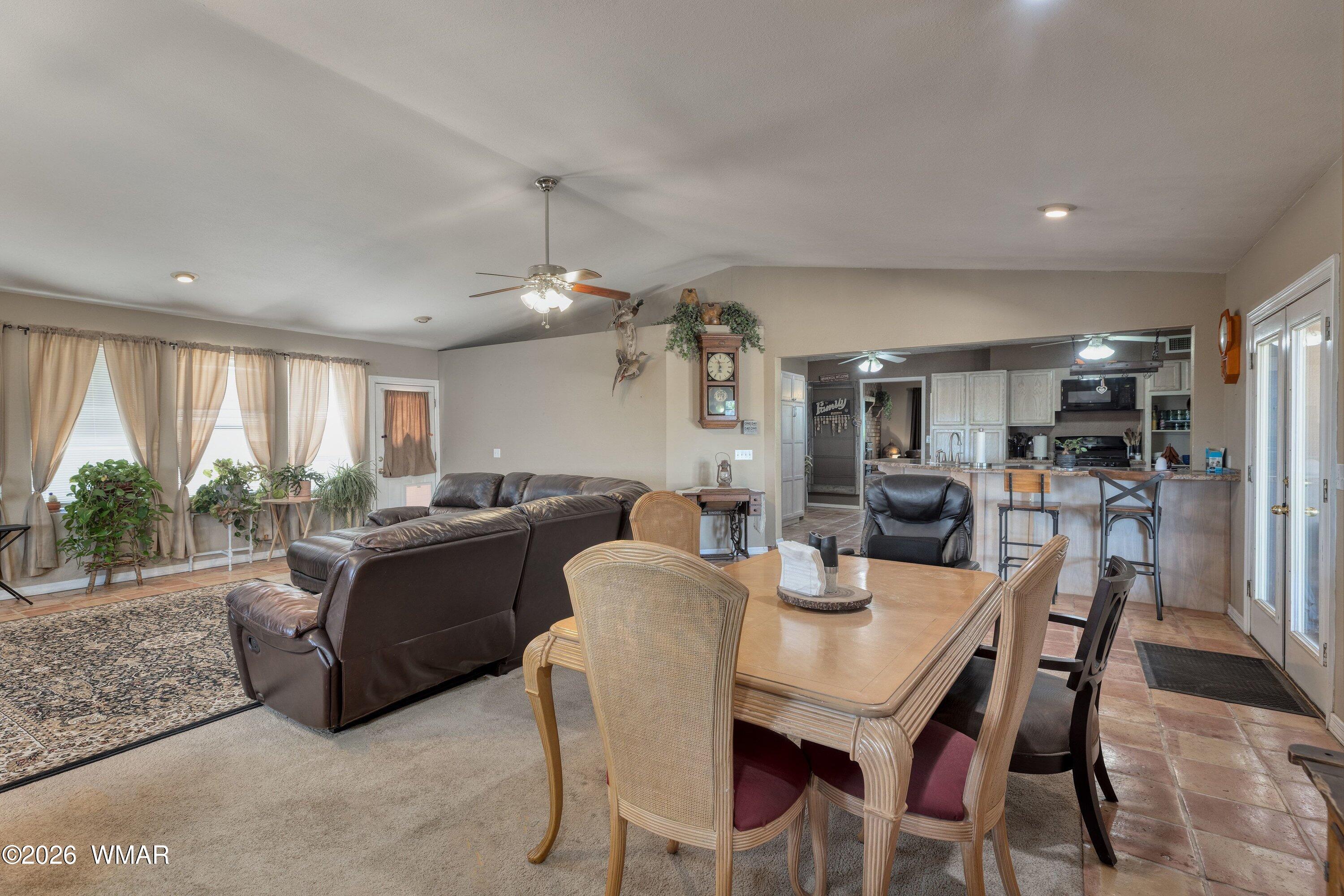1114 Ranch Road Taylor, AZ 85939 - Photo 10 of 32 a view of a dining room with furniture window and outside view