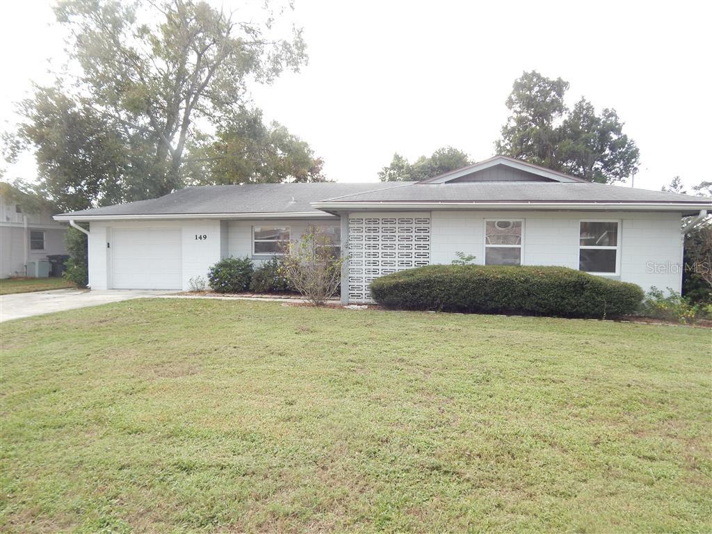 149 Whitman Road Winter Haven, FL 33884 - Photo 1 of 1 a front view of house with yard and trees around