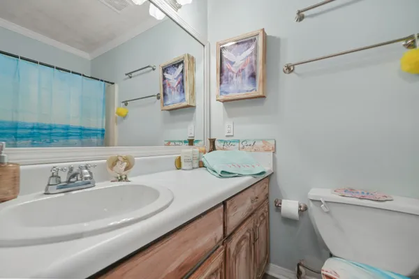 a bedroom with a bed and chandelier