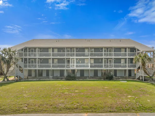 a view of a large building with a swimming pool