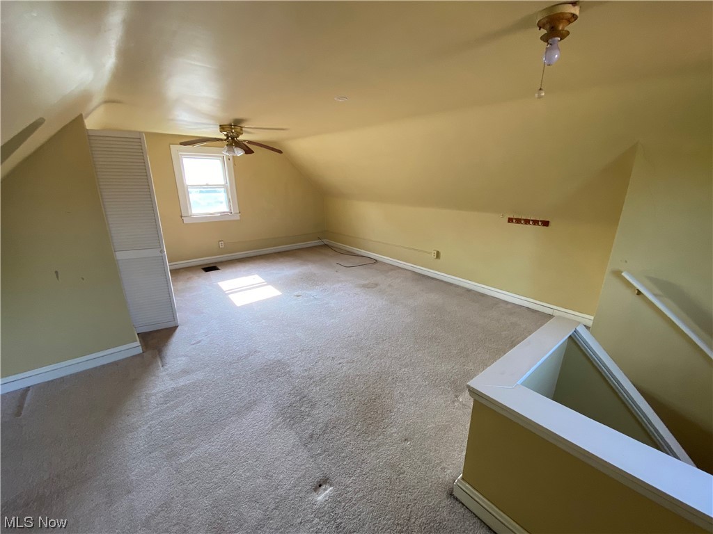 3630 Bainbridge Road Cleveland Heights, OH 44118 - Photo 18 of 21 Additional living space with light carpet, ceiling fan, and vaulted ceiling