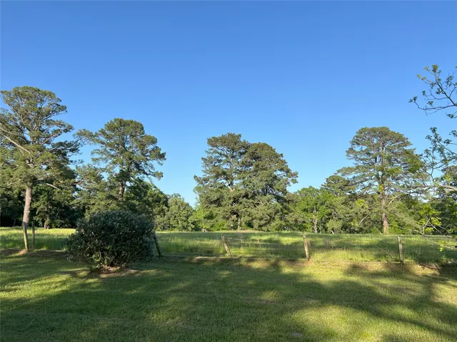 a view of lake with green space