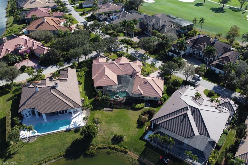 435 Terracina Way Naples, FL 34119 - Photo 42 of 50 Aerial view of residential area with a golf club and a pool