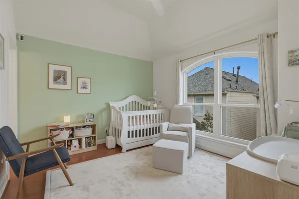a bedroom with furniture and a window
