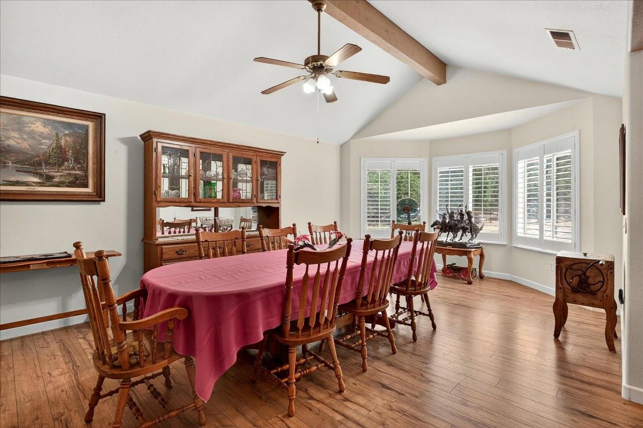38090 Wortham Road Oakhurst, CA 93644 - Photo 13 of 54 a view of a dining room with furniture window and wooden floor