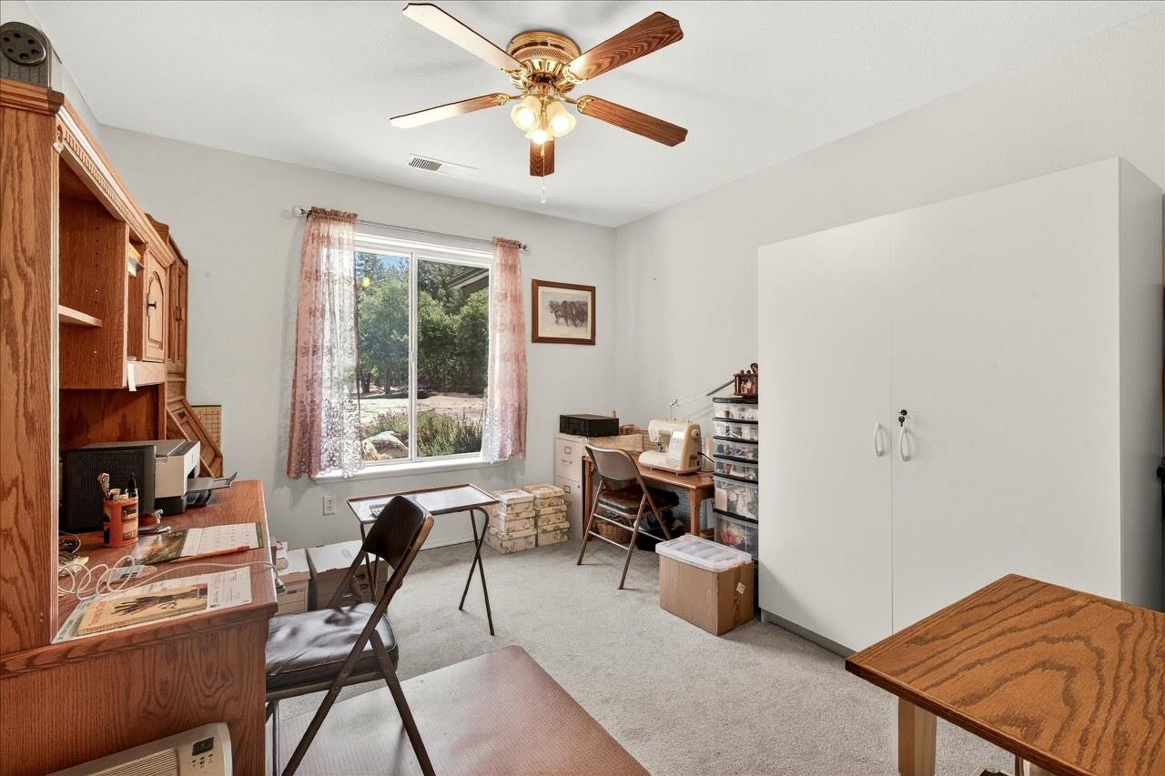 38090 Wortham Road Oakhurst, CA 93644 - Photo 22 of 54 a living room with furniture and a window