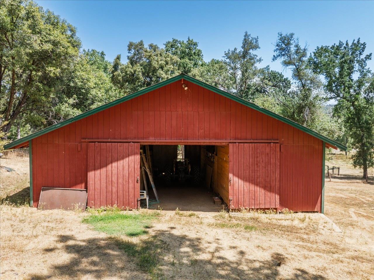 38090 Wortham Road Oakhurst, CA 93644 - Photo 44 of 54 a backyard of a house with lots of green space