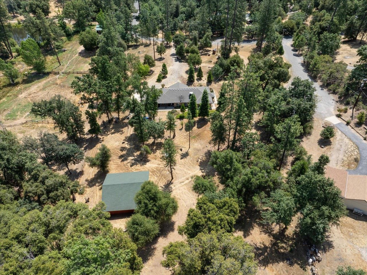38090 Wortham Road Oakhurst, CA 93644 - Photo 50 of 54 an aerial view of residential house with outdoor space and trees all around