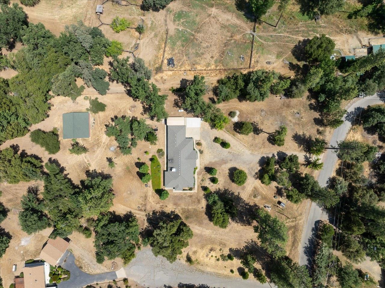 38090 Wortham Road Oakhurst, CA 93644 - Photo 54 of 54 an aerial view of residential houses with outdoor space