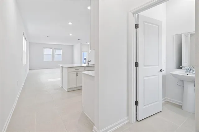 a bathroom with a sink a mirror and a shower