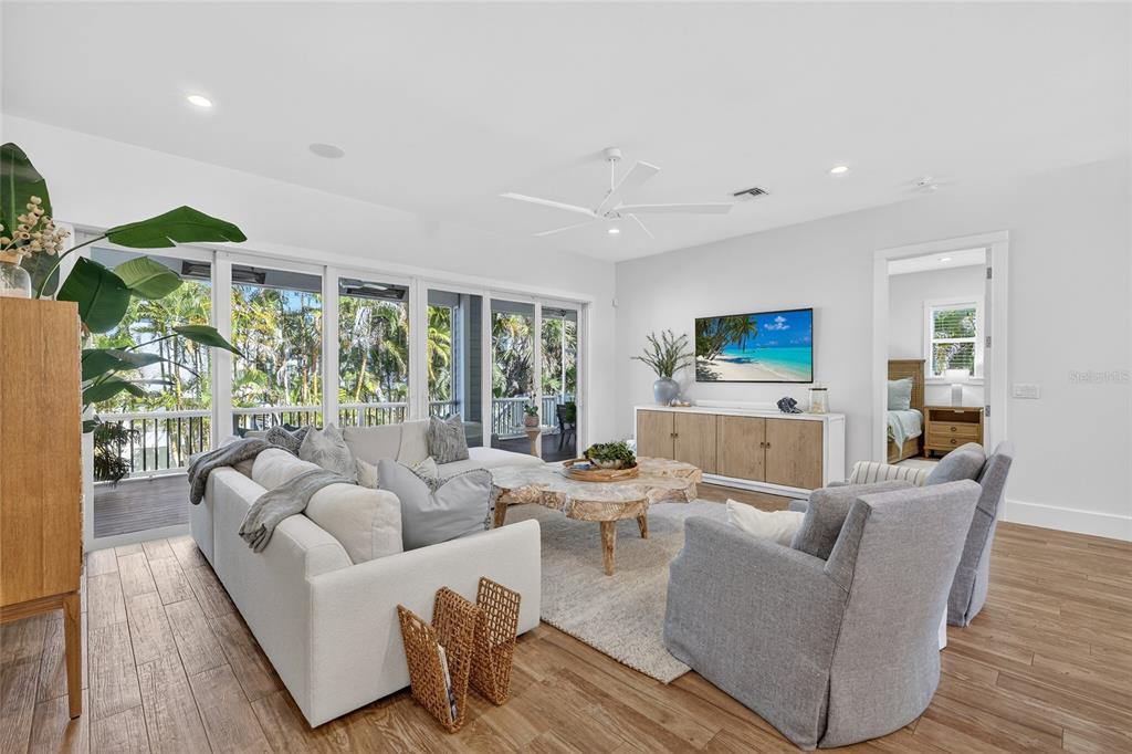 261 Seabreeze Court Boca Grande, FL 33921 - Photo 11 of 44 a living room with furniture and a large window