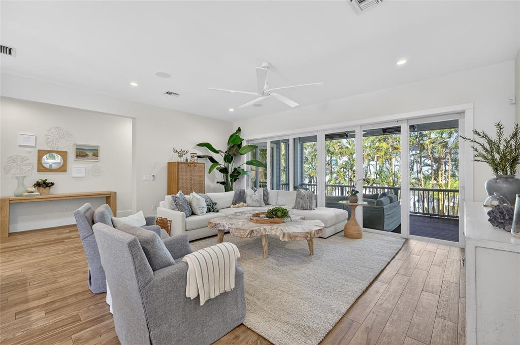 261 Seabreeze Court Boca Grande, FL 33921 - Photo 12 of 44 a living room with furniture and a large window
