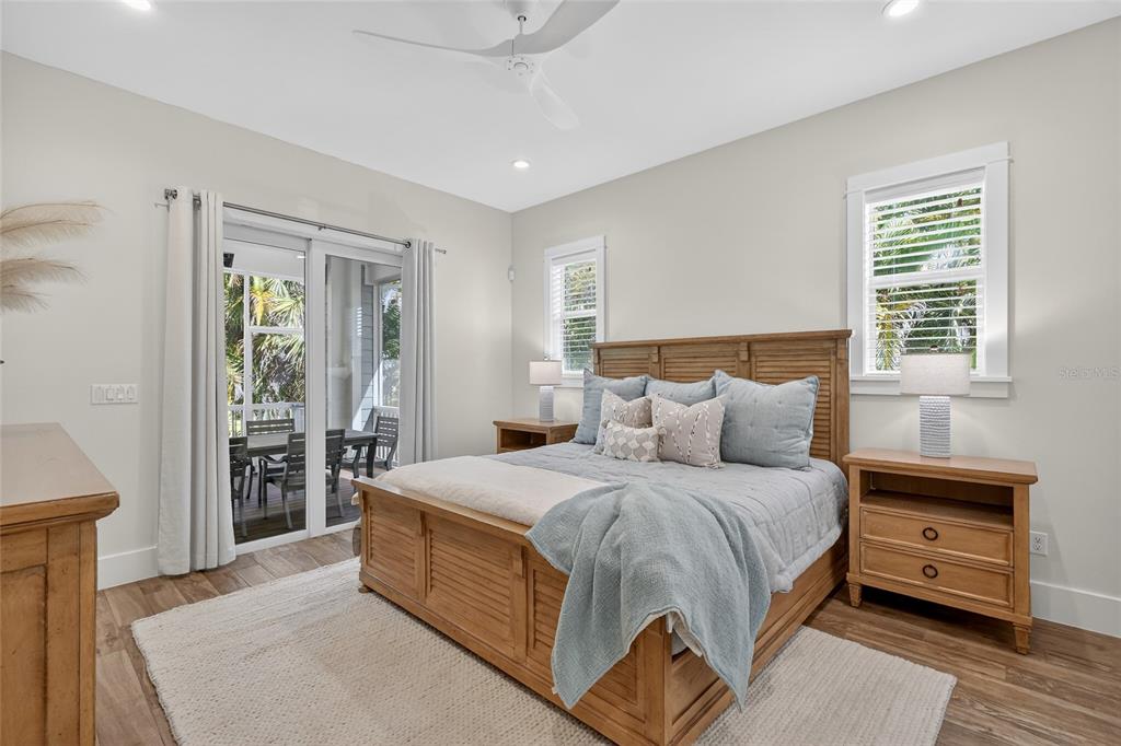 261 Seabreeze Court Boca Grande, FL 33921 - Photo 14 of 44 a bedroom with a large bed and a window