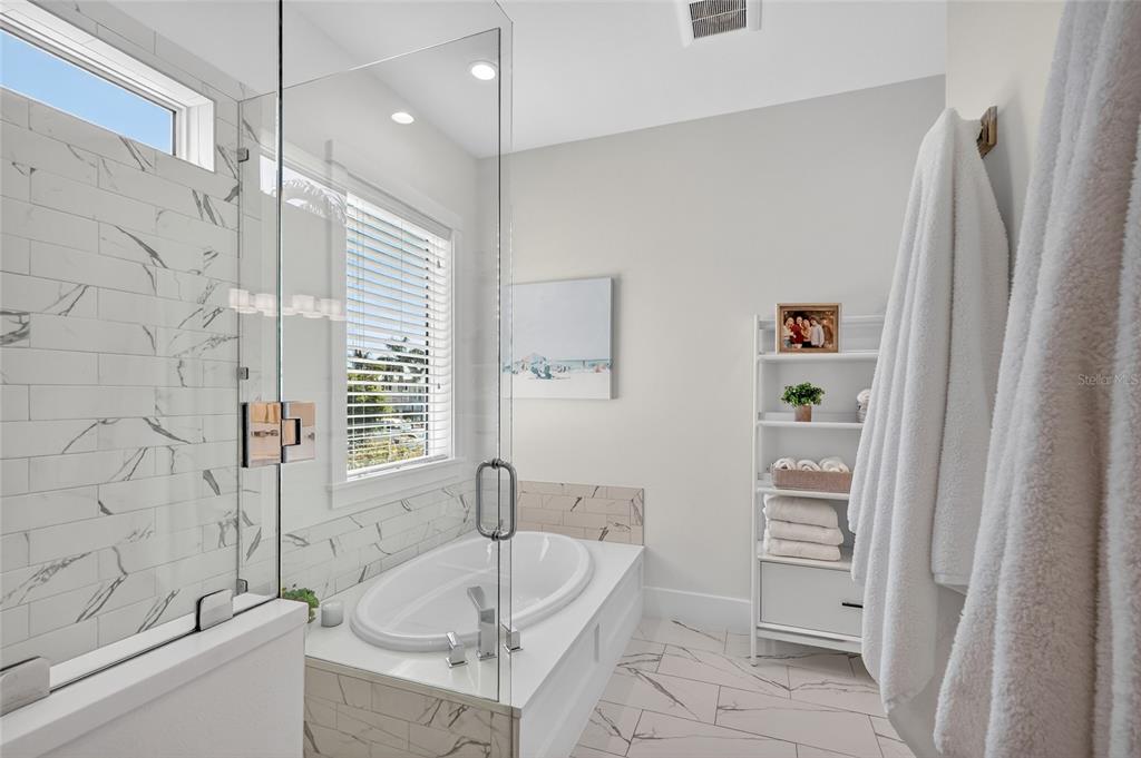 261 Seabreeze Court Boca Grande, FL 33921 - Photo 16 of 44 a bathroom with a tub a sink and a shower
