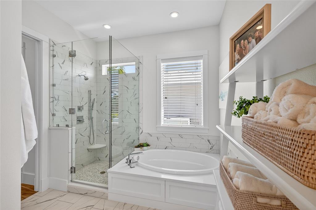 261 Seabreeze Court Boca Grande, FL 33921 - Photo 18 of 44 a bathroom with a tub shower and sink