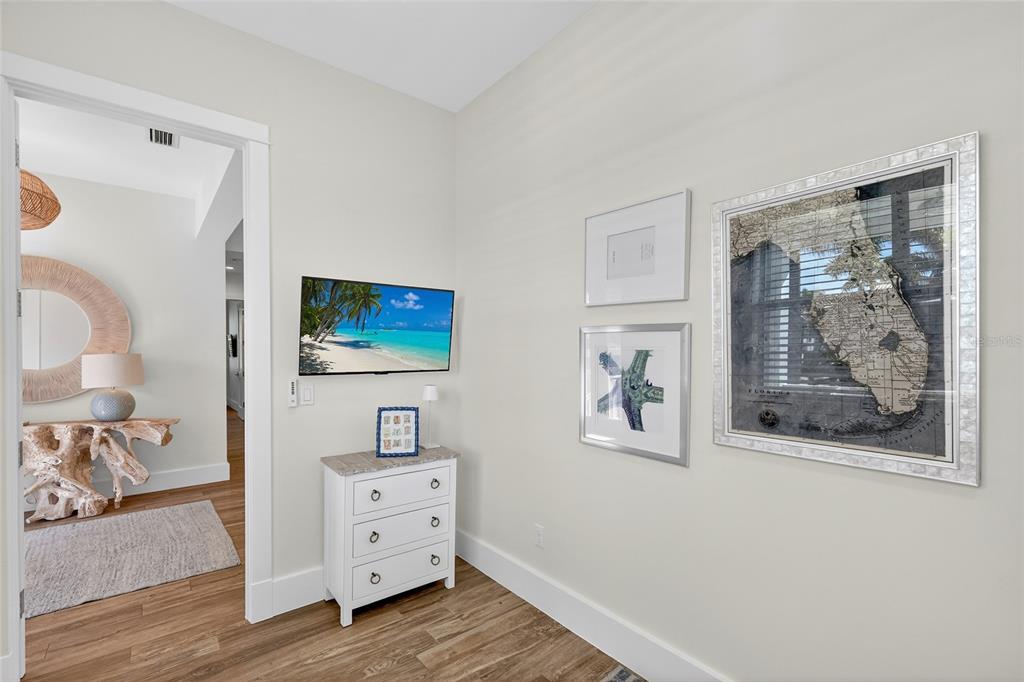 261 Seabreeze Court Boca Grande, FL 33921 - Photo 20 of 44 a living room with furniture and a flat screen tv