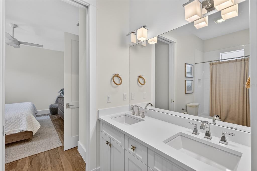 261 Seabreeze Court Boca Grande, FL 33921 - Photo 23 of 44 a bathroom with a sink a mirror and a shower