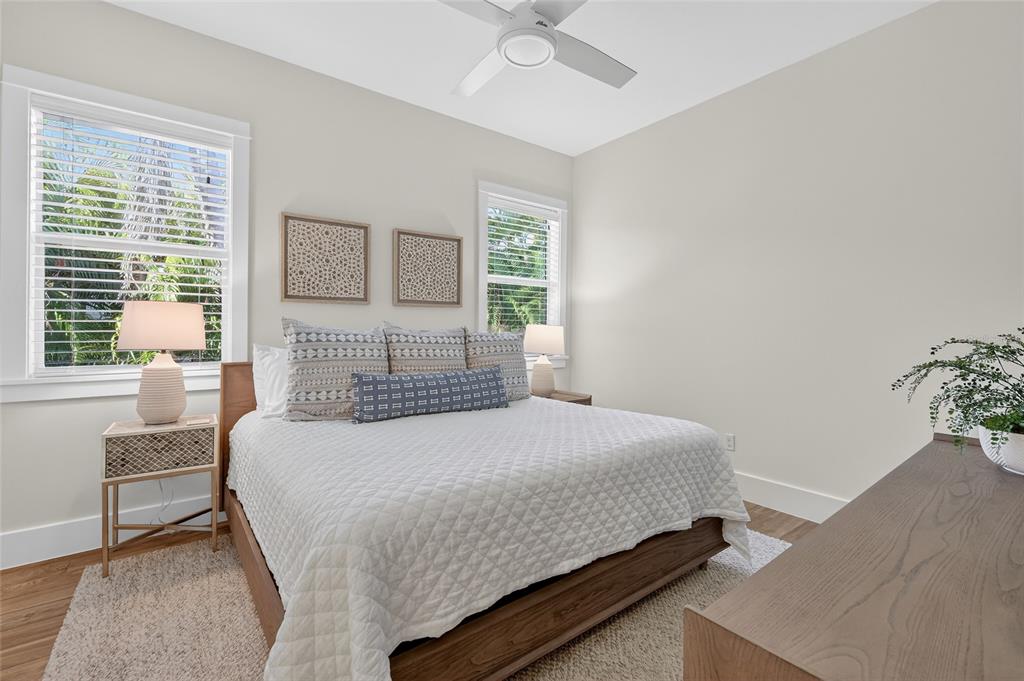 261 Seabreeze Court Boca Grande, FL 33921 - Photo 26 of 44 a bedroom with a bed and a window