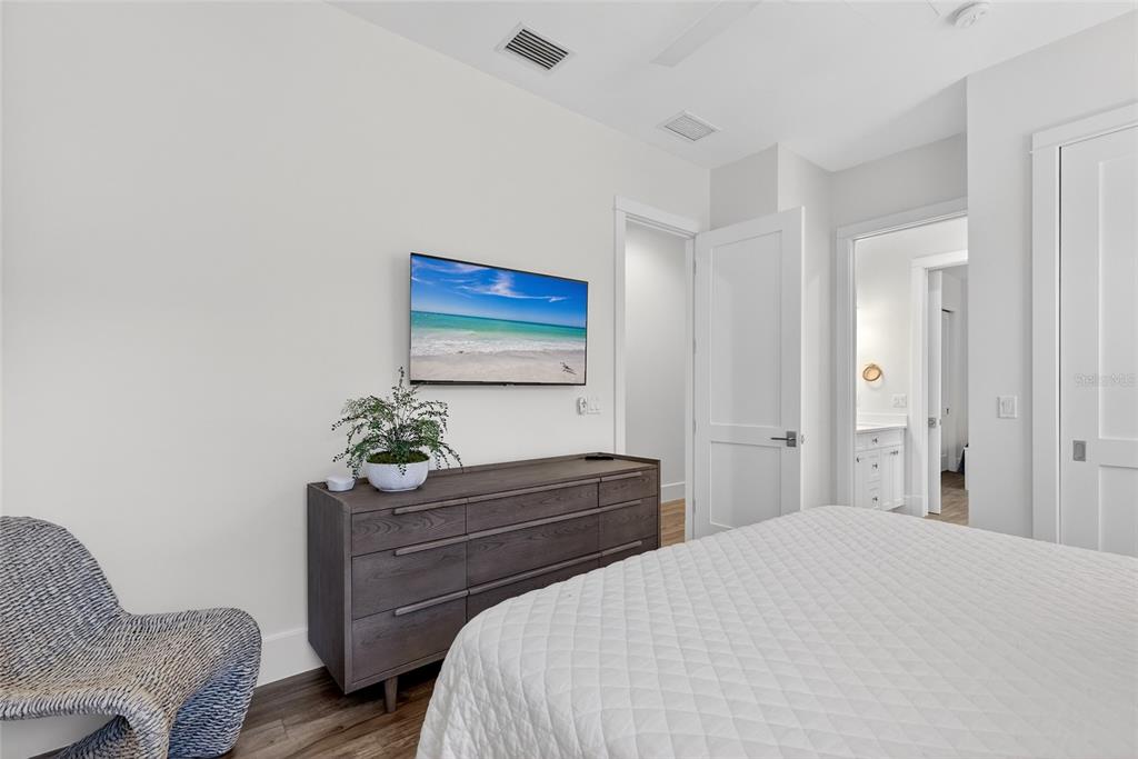 261 Seabreeze Court Boca Grande, FL 33921 - Photo 27 of 44 a bedroom with a bed table chair and a couch