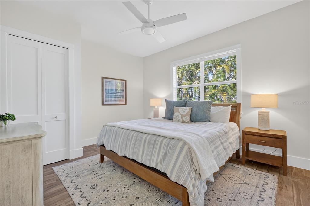 261 Seabreeze Court Boca Grande, FL 33921 - Photo 28 of 44 a bedroom with a bed and a window