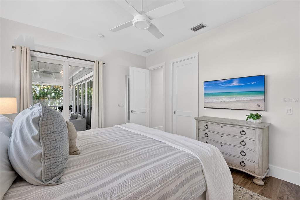 261 Seabreeze Court Boca Grande, FL 33921 - Photo 29 of 44 a bedroom with a bed and a dresser
