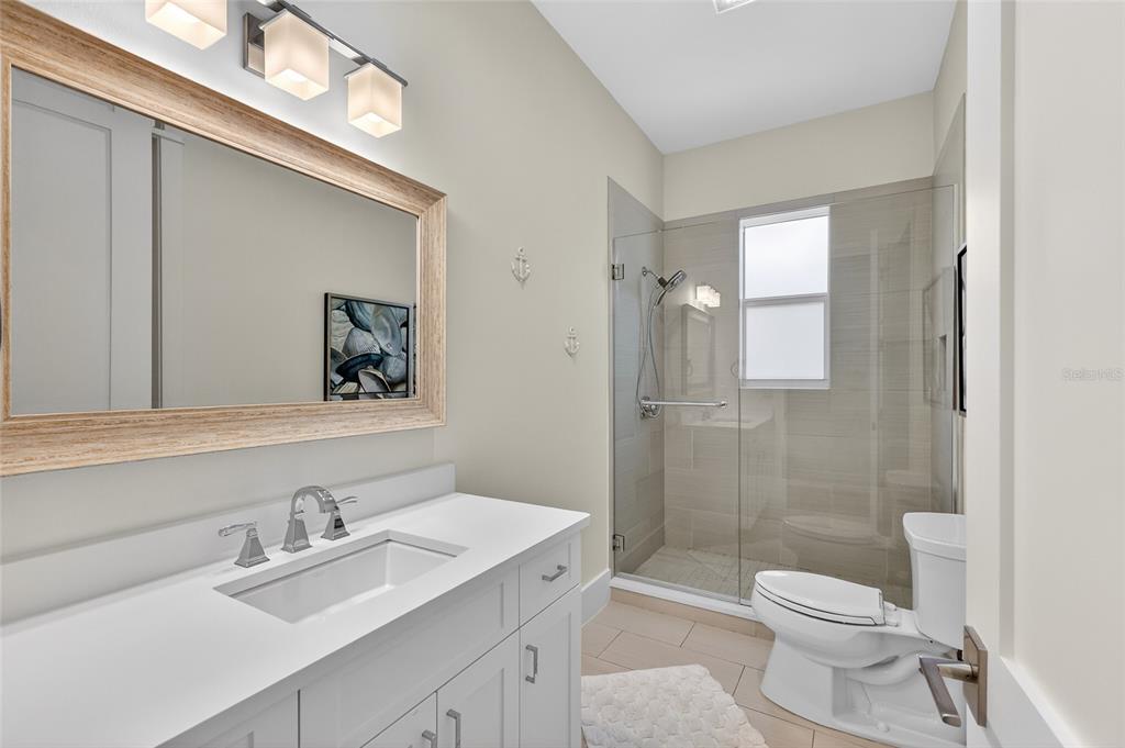 261 Seabreeze Court Boca Grande, FL 33921 - Photo 30 of 44 a bathroom with a sink a toilet and shower