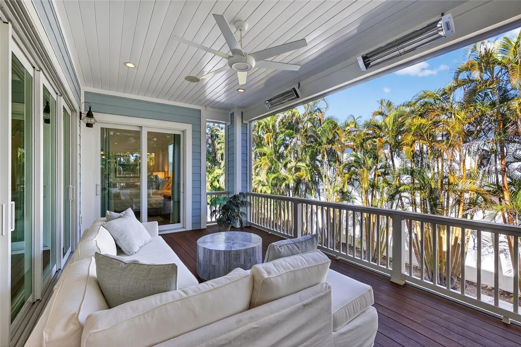 261 Seabreeze Court Boca Grande, FL 33921 - Photo 31 of 44 a balcony with furniture and a large window