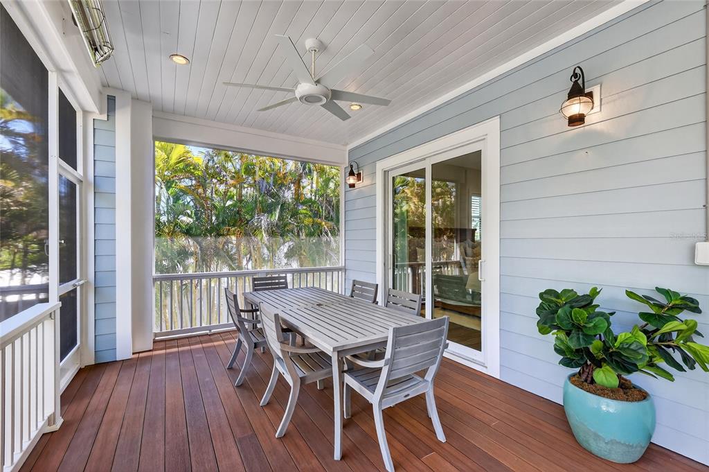 261 Seabreeze Court Boca Grande, FL 33921 - Photo 33 of 44 a view of a dining room with furniture window and wooden floor