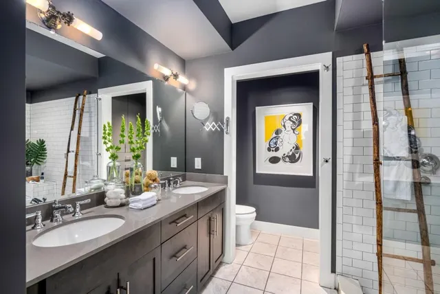 a living room with patio furniture and a potted plants