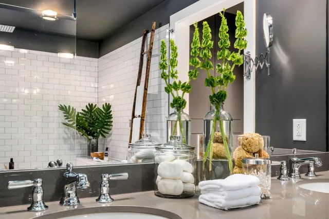 a bathroom with a tub shower and sink