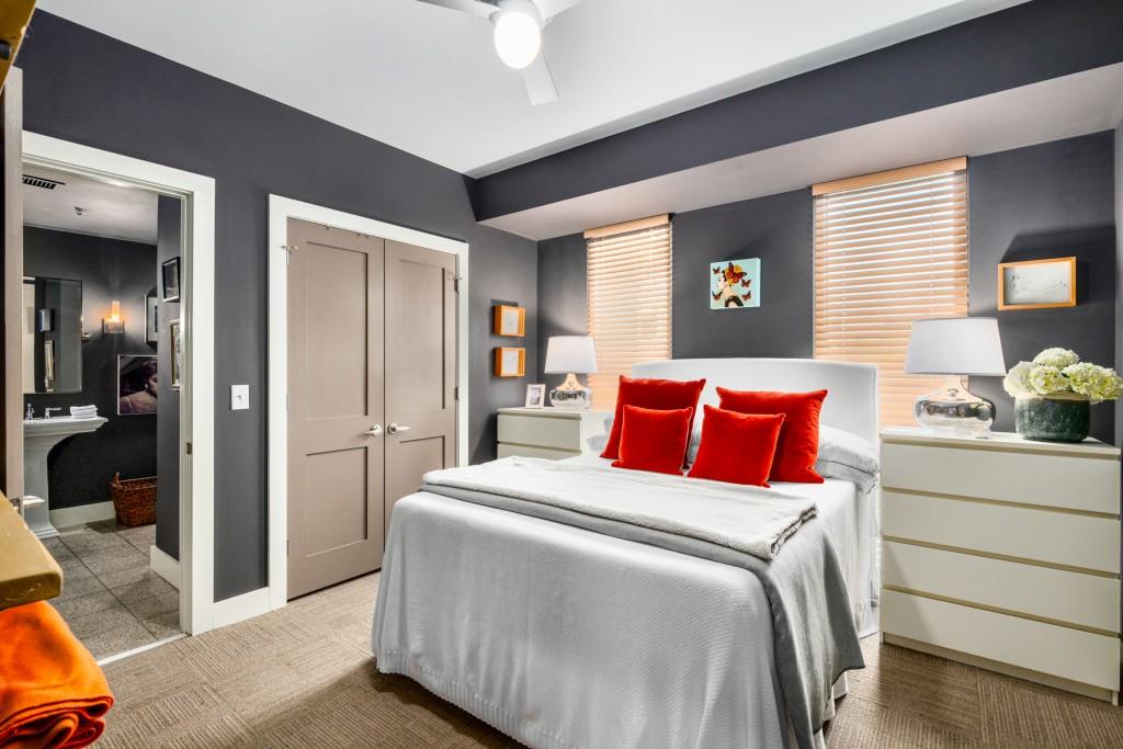 1100 Howell Mill Road Northwest, Unit 201 Atlanta, GA 30318 - Photo 15 of 50 a bedroom with a bed and a dresser