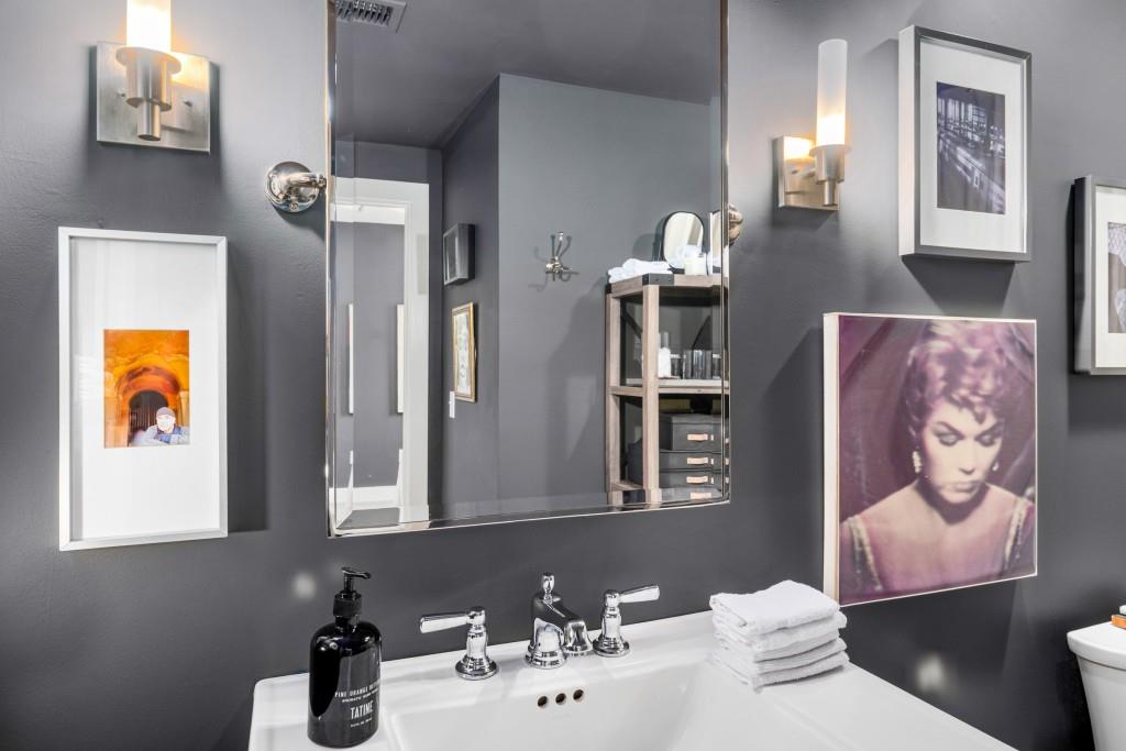 1100 Howell Mill Road Northwest, Unit 201 Atlanta, GA 30318 - Photo 17 of 50 a bathroom with a sink mirror and toilet