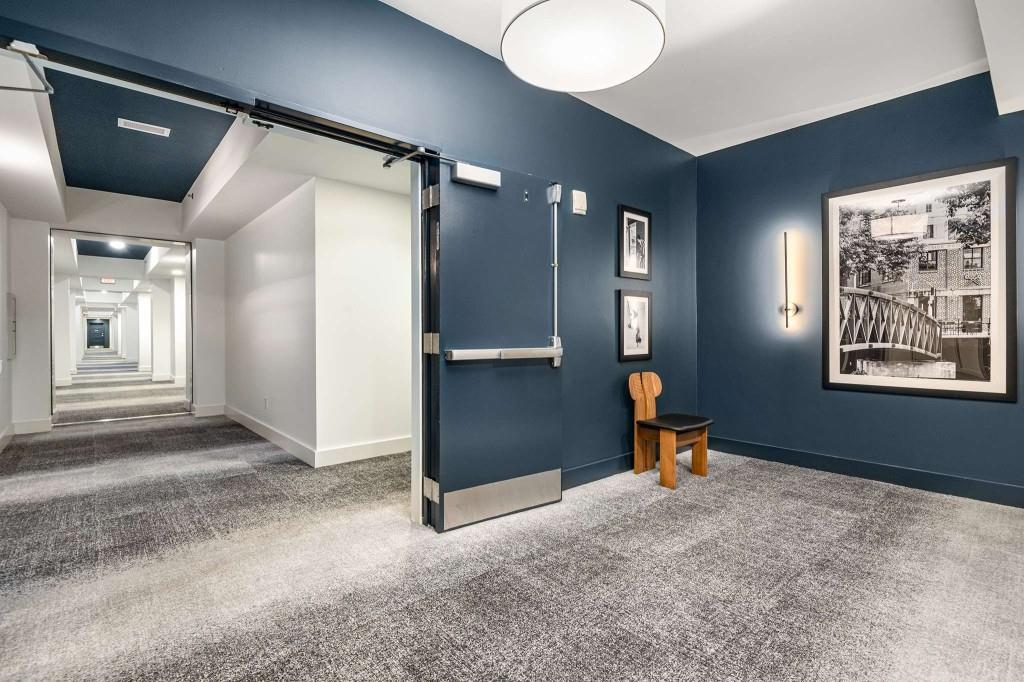 1100 Howell Mill Road Northwest, Unit 201 Atlanta, GA 30318 - Photo 26 of 50 a view of a livingroom with a piano and wooden floor