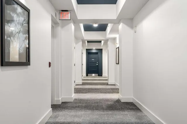 front view of a building with potted plants