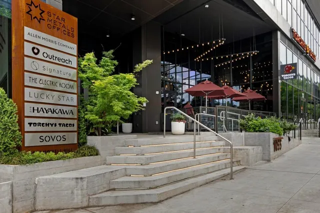 a view of a building and a people on a street