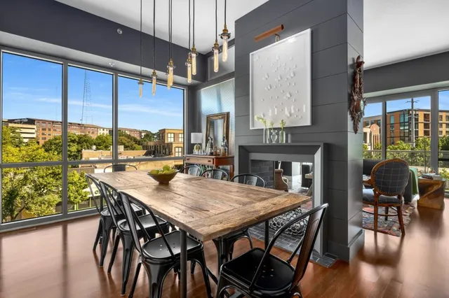a view of a dining room with furniture window and wooden floor