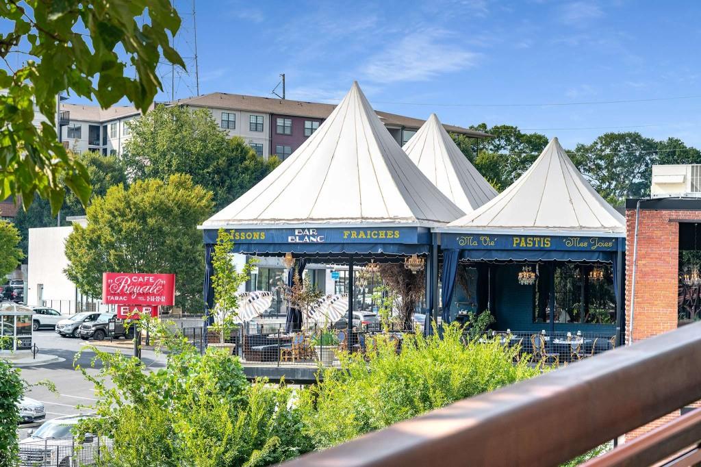 1100 Howell Mill Road Northwest, Unit 201 Atlanta, GA 30318 - Photo 41 of 50 a view of a house with sitting area and garden