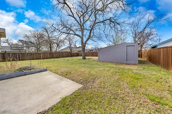 a house with trees in the background