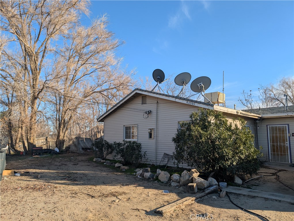 43365 147th Street East Lancaster, CA 93535 - Photo 2 of 2 a front view of a house with garden